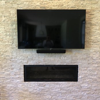 The Flatscreenguru - Flat TV and sound bar installed over veer chimney wall - Home Theatre Installation Near Me The Flatscreenguru - Flat TV and sound bar installed over veer chimney wall - Home Theatre Installation Near Me