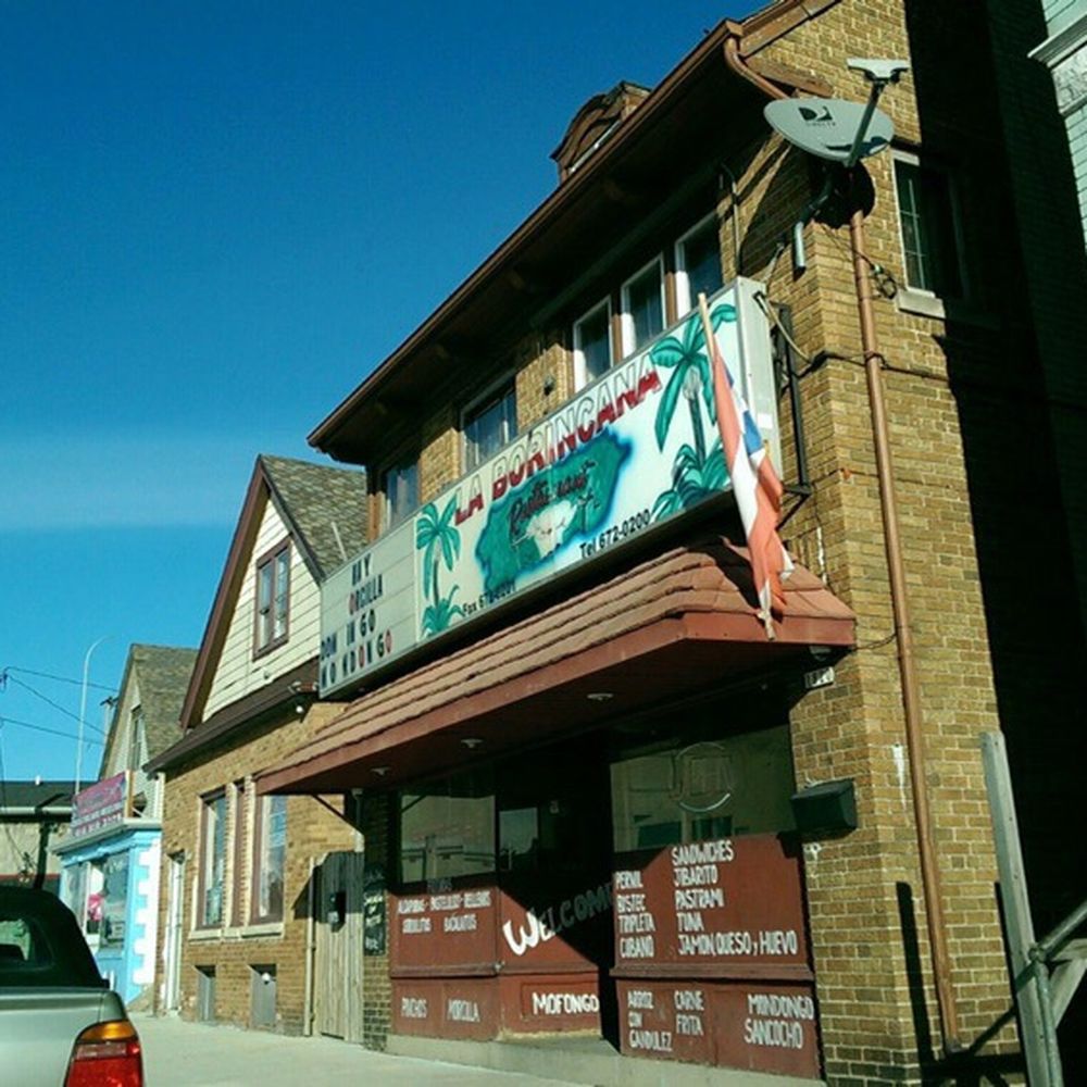 La Borincana - a car parked in front of a building - Puerto Rican Near Me - Milwaukee, Wisconsin