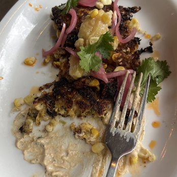 Asheville Proper - Corn fritter. 1/2 eaten. - Tapas/Small Plates Near Me - Asheville, North Carolina Asheville Proper - Corn fritter. 1/2 eaten. - Tapas/Small Plates Near Me - Asheville, North Carolina