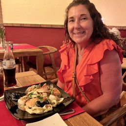 My wife with the seafood pasta. My wife with the seafood pasta.
