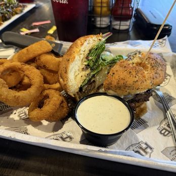 The Hub Grill And Bar - Mushroom Swiss burger and onion rings - Sports Bars Near Me - Mesa, Arizona The Hub Grill And Bar - Mushroom Swiss burger and onion rings - Sports Bars Near Me - Mesa, Arizona