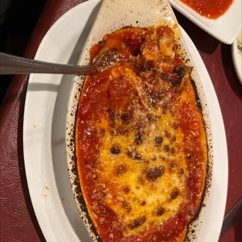 Luigi's Italian Restaurant - a pizza on a white plate - Italian Near Me - Winfield, Kansas Luigi's Italian Restaurant - a pizza on a white plate - Italian Near Me - Winfield, Kansas