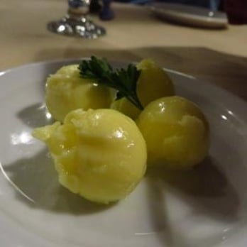 The Rib Room - three peeled potatoes on a plate - Hotels Near Me - Winnipeg, Manitoba The Rib Room - three peeled potatoes on a plate - Hotels Near Me - Winnipeg, Manitoba
