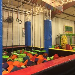 Flippin' Family Fun - Bigger kids challenge area with foam pit