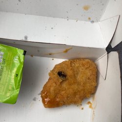 McDonald's - Found black stuff in middle of nugget. Called and they basically said oh well. It's not a chocolate chip or dough I felt it. It's gross.