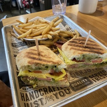 The Peach Cafe - Breakfast Panini. It comes with pesto, eggs, tomato, and bacon. One of the best I have had in a very long time. - New American Near Me - Monrovia, California The Peach Cafe - Breakfast Panini. It comes with pesto, eggs, tomato, and bacon. One of the best I have had in a very long time. - New American Near Me - Monrovia, California