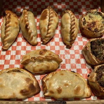 Rika's Empanadas - Dozen empanadas but sadly only had 11 when I got home and opened the box. I had already eaten 1 spinach before taking this pic too. - Argentine Near Me - Glendora, California