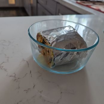 Tito's Restaurant - Breakfast burrito, so large that even half of it fills an entire glass lock container. - Bakeries Near Me - Long Beach, California