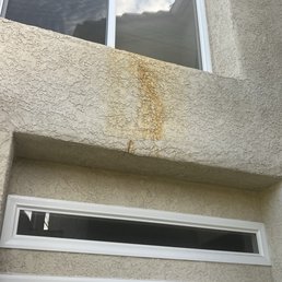 Before photo: Rust stain on exterior stucco Before photo: Rust stain on exterior stucco