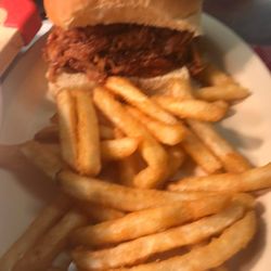 Rednick Rick’s Cooking - Pork sandwich and choose a side Seasoned fries are tasty!