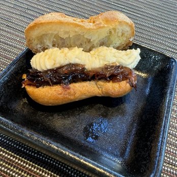 Amelia Gene's - Goat cheese with onion jam and honey eclair - Bars Near Me - Memphis, Tennessee