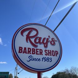 Ray's Barber Shop - Sign on the road