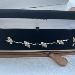 La Masters Fine Jewelry - White gold with yellow sapphires.  This bracelet is a custom piece of jewelry La Masters made for my wife.