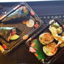 Spicy salmon and spicy tuna hand rolls with dynamite roll. Spicy salmon and spicy tuna hand rolls with dynamite roll.