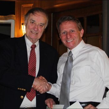 Paul Falvey - Dr. Falvey right, pictured with Dr. Hilt Tatum. Dr. Tatum presenting an award on dental implantology to Dr. Falvey in France. - General Dentistry Near Me - Grass Valley, California