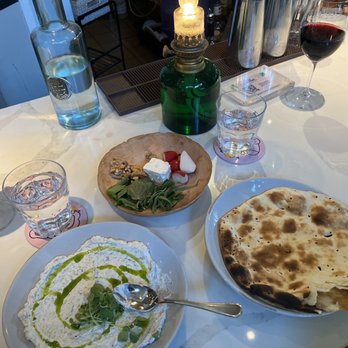 Delbar Middle Eastern - Dill yogurt spread with complimentary bread, Tehrangeles cocktail on the left. - Persian/Iranian Near Me - Atlanta, Georgia