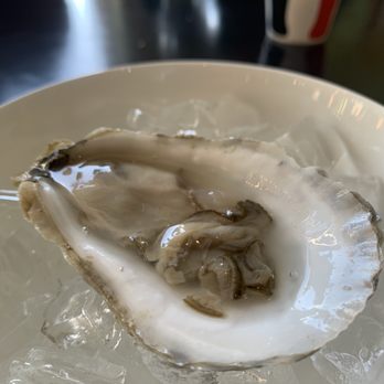 Krewe Restaurant - Oyster. Just one. - Cajun/Creole Near Me - Saint Joseph, Minnesota