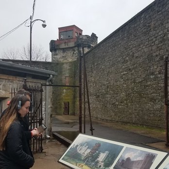 Eastern State Penitentiary - This is the courtyard area. As you can see this couple has the self-guided audio your headphones. - Landmarks & Historical Buildings Near Me - Philadelphia, Pennsylvania