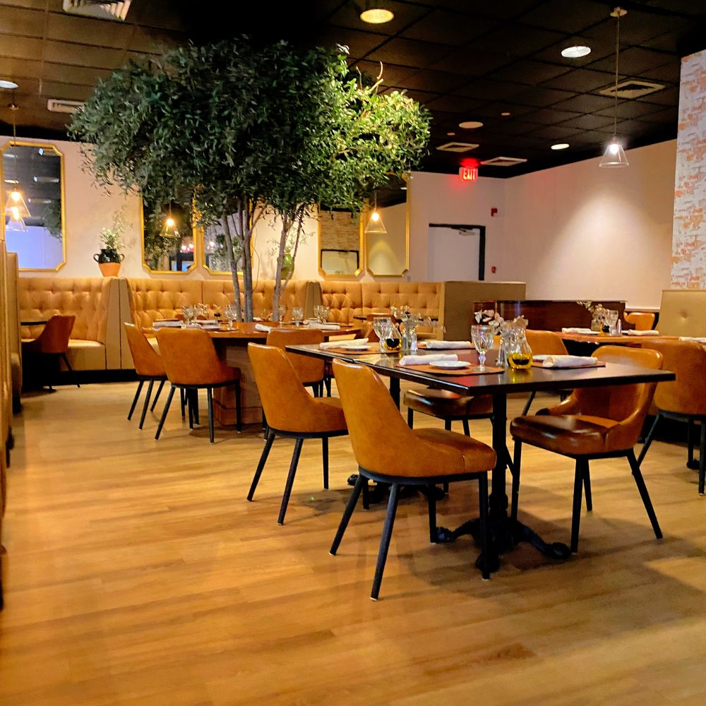 The Vine Restaurant - tables and chairs in a restaurant - Italian Near Me - Falmouth, Massachusetts The Vine Restaurant - tables and chairs in a restaurant - Italian Near Me - Falmouth, Massachusetts