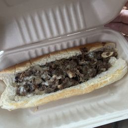 a sandwich in a styrofoam container