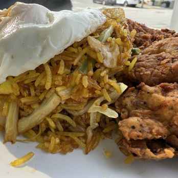 Cracked & Battered - Potrero Hill - UP CLOSE AND PERSONAL: Indonesian chicken fried rice with cabbage, cilantro, garlic, onions, and is topped with two eggs. - Breakfast & Brunch Near Me - San Francisco, California