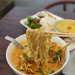 Khaosan Thai - Khao Soi in the front and yellow curry lunch combo in the back