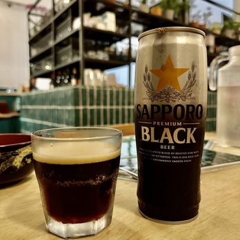 Wo Sushi Fusion - a glass of beer and a can of black ale - Sushi Bars Near Me - Montgomery, Texas Wo Sushi Fusion - a glass of beer and a can of black ale - Sushi Bars Near Me - Montgomery, Texas