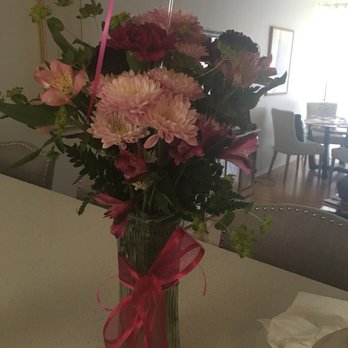Flower Works - A couple of asters with 3 carnations and two day lilies.  Worth about $10.00 not the $48.16 that was charged. - Florists Near Me - Artesia, California