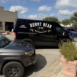 There van outside restaurant in downtown Seguin