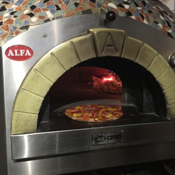 Pazza Pazza - a pizza cooking in a brick oven - Pizza Near Me - York, Ontario Pazza Pazza - a pizza cooking in a brick oven - Pizza Near Me - York, Ontario