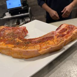 two slices of bacon on a plate