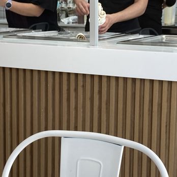 Scoop n Roll - Scooping rolled ice cream into cup - Desserts Near Me - Edmonton, Alberta