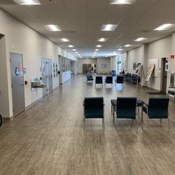 VA Palm Desert - Inside VA Clinic Left Is Ck. In & Right Is In/Out Doors. Again Looks Of an Abandoned DMV. 07/2025 Staff Behind The Glass Very Loud & Chatty