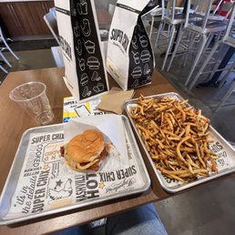 Large (HUGE) fry & Hot Honey sandwich, which looked picture perfect before I loaded fries onto it! Got one to-go for my dad too :-) Large (HUGE) fry & Hot Honey sandwich, which looked picture perfect before I loaded fries onto it! Got one to-go for my dad too :-)