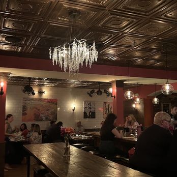 Bar Sera - people sitting at tables and a chandelier - New American Near Me - Conshohocken, Pennsylvania