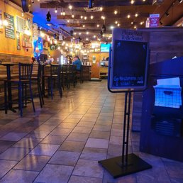 an empty restaurant with tables and chairs