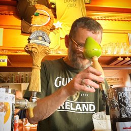 a man holding a green apple a man holding a green apple