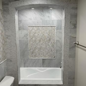 Santangelo Construction - Cast iron tub with Italian mosaic tile - General Contractors Near Me - Vero Beach, Florida Santangelo Construction - Cast iron tub with Italian mosaic tile - General Contractors Near Me - Vero Beach, Florida