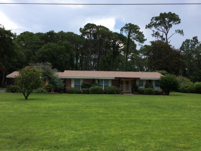 Slide of Greg's Roofing Of Bay County