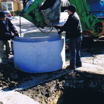 Nuzzo Sewer & Plumbing - a group of men working on a hole - Plumbing Near Me - Chicago, Illinois Nuzzo Sewer & Plumbing - a group of men working on a hole - Plumbing Near Me - Chicago, Illinois