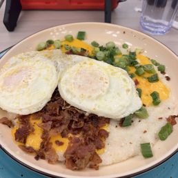 Loaded grits with two eggs over easy Loaded grits with two eggs over easy