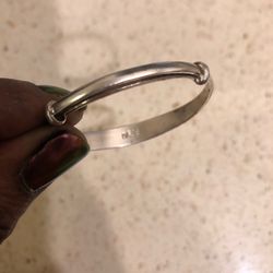 American Jewelry & Diamond Exchange - "Silver" bracelet. It's made of tin.