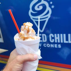 Twisted chill Snow Cones - Snow cone topped with cream and caramel
