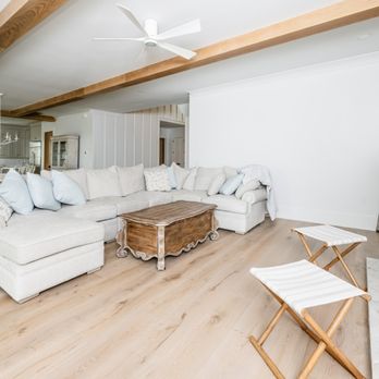 Jackson Construction - a living room with white furniture - General Contractors Near Me - Charleston, South Carolina
