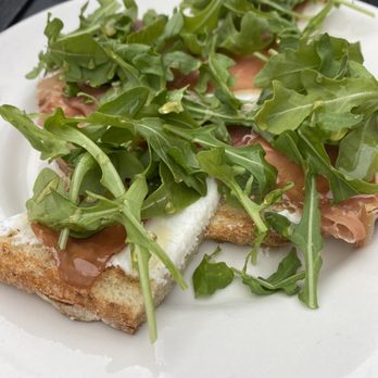Sophia's Grotto - Prosciutto, Honey, Arugala, & Ricotta Crostini - Italian Near Me - Roslindale, Massachusetts Sophia's Grotto - Prosciutto, Honey, Arugala, & Ricotta Crostini - Italian Near Me - Roslindale, Massachusetts