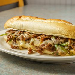 Anthony's Pizzeria - Shaved Grilled Steak and Provolone Cheese with Grilled Onions, Grilled Mushrooms and Grilled Green Peppers.
Toasted Bread.