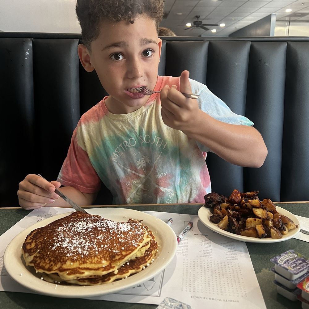 Three stack of Oreo pancakes and home fries. Three stack of Oreo pancakes and home fries.