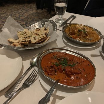 Akbar Restaurant - Butter chicken and fish curry with garlic naan - Indian Near Me - Edison, New Jersey
