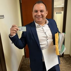 Burga Law Firm - Client with his green card!