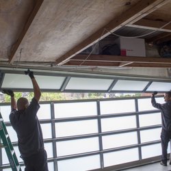 Garage Door Medics - Pedro and Otto installing a Full View Glass Door